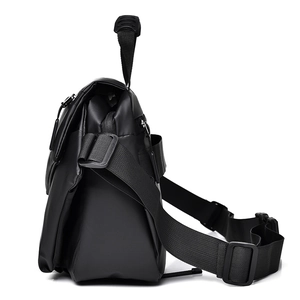 Side view of sleek black crossbody bag for men with adjustable strap and waterproof finish
