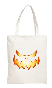 Close-up of white canvas tote bag featuring a vibrant 2D digital pumpkin face print