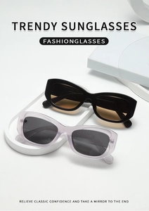 Detail of vintage square sunglasses in black and translucent lavender on a white stand