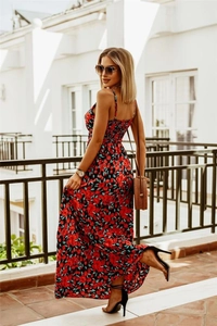 Detail of red floral print on bohemian maxi dress with V-neck sleeveless strap design