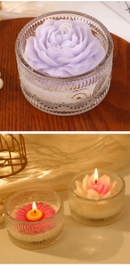 Macro shot of purple rose scented candle in embossed glass jar on rustic wood background