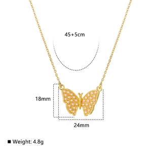 Detailed view of 18k gold butterfly pendant with pearls showing 45+5cm chain dimensions