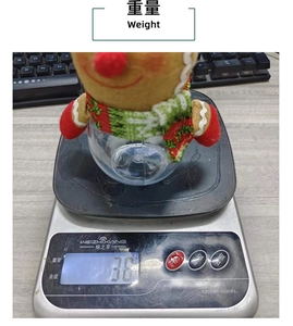 Christmas gingerbread man candy jar being weighed on a scale to show its light weight