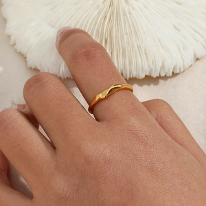 Minimalist gold stainless steel irregular bamboo-style open ring worn on a finger