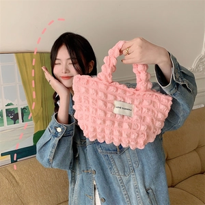 Detailed close-up of pink bubble textured canvas tote bag with Love Sozakka label