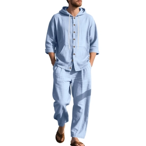 Detail of light blue linen blend hooded shirt and trousers showing fabric texture and finish