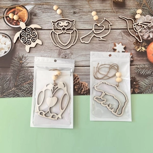 Detailed view of handcrafted wooden animal pendants with jute rope and rustic wood beads