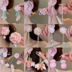 Collection of nine pink floral tassel earrings with pearls for beach vacation style