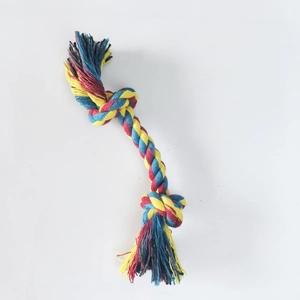 Close-up of the woven texture on a three-strand multi-color cotton rope dog chew toy
