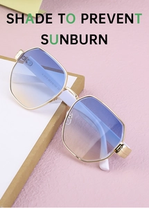 Close-up of golden metal frame sunglasses with blue gradient lenses and white temples