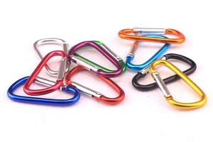 Assorted colorful D-shaped aluminum carabiners in red, blue, purple, and green metal