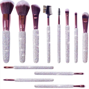Luxury 12-piece crystal encrusted makeup brush set with rose gold metal and gradient bristles