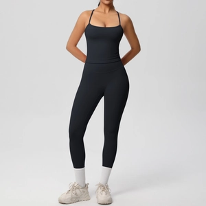 Close-up of black high-waist yoga set with thin straps and supportive matte fabric