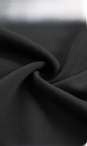 Close-up of premium black knitted fabric texture on crewneck sweatshirt for men