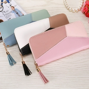 Three long PU leather patchwork wallets with tassel zippers and geometric design