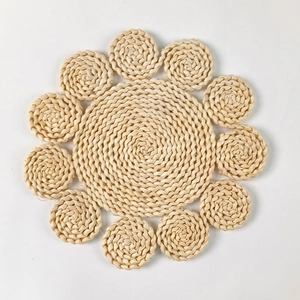 Macro detail of sunflower-shaped handmade woven corn husk heat-resistant table mat