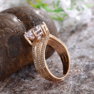 Detail of rose gold engagement ring with large AAA zircon and multi-layered wavy pavé band