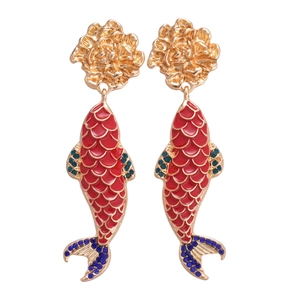 Vintage gold koi fish earrings with red enamel and blue crystals on white background