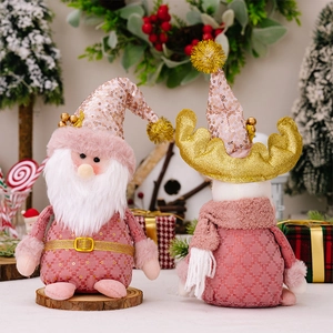 Detailed view of pink Christmas plush gnomes with sequins and festive studio background