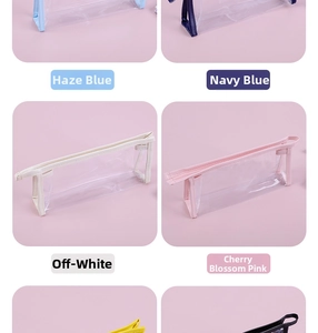 Close-up of minimalist transparent pencil cases in blue, navy, beige, and pink colors