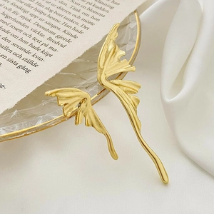 Minimalist liquid gold butterfly wing earrings in asymmetrical organic metal design