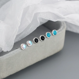 Detailed view of S925 silver stud earrings with opal, agate, and turquoise inlays