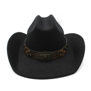 Detail of western cowboy hat with faux leather band and metallic bull skull ornament