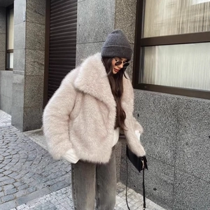 Fashionable faux fur jacket with large lapel collar for women in light pink and beige