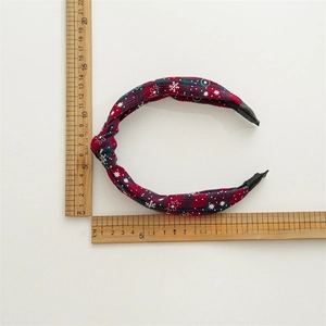 Christmas headband with red and green plaid snowflakes fabric on white background