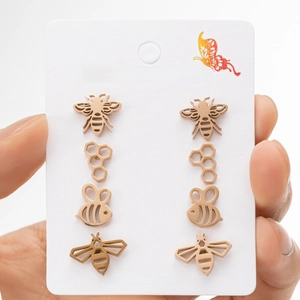 Rose gold stainless steel bee and honeycomb stud earring set with four distinct pairs