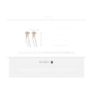 Detailed view showing the 7.5cm length and size dimensions of bow tassel drop earrings