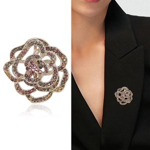 Elegant cutout camellia flower brooch with colorful rhinestones in a stylish design