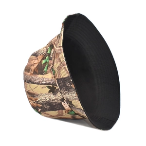 Close-up of jungle tree camo bucket hat with durable canvas texture and black lining