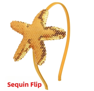 Detail of a golden reversible sequin starfish headband for girls with metallic finish