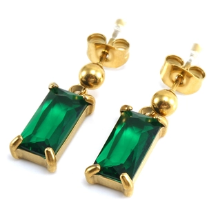 Detail of 18K gold plated earrings featuring emerald green rectangular cut cubic zirconia