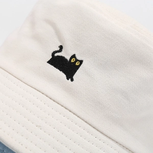 Breathable cream cotton bucket hat featuring a cute black cat embroidery for summer