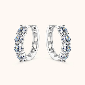 Macro detail of S925 sterling silver hoop earrings with multiple round moissanite stones