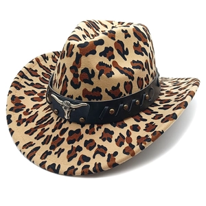Macro detail of leopard print cowboy hat with studded leather band and silver bull emblem