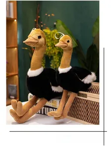 Pair of ostrich plush toys in large and small sizes seated on books for home decor
