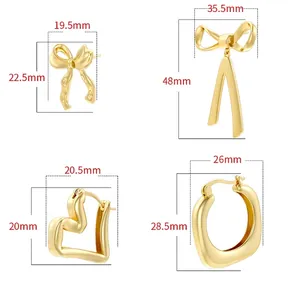Polished gold geometric earrings set featuring bow, heart, and irregular hoop designs