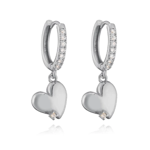 Close-up of silver heart drop hoop earrings with sparkling micro-pave crystal accents