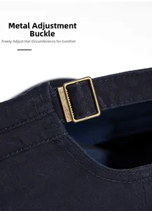 Detailed shot of an adjustable bronze metal buckle on a navy blue cotton military cap