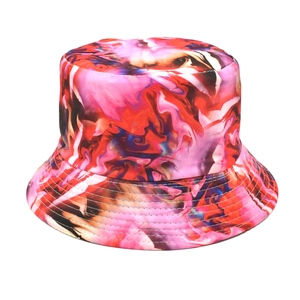 Close-up of colorful tie-dye bucket hat with reinforced stitching and abstract ink patterns