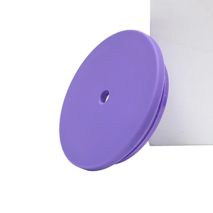 Close-up of purple round silicone lid with center straw hole for double-wall plastic cup