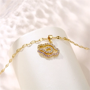 Elegant gold titanium necklace featuring a cloud pendant set with white and purple zircons