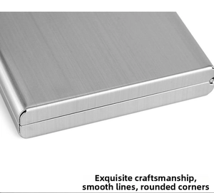 Detail of the brushed silver stainless steel wallet with smooth rounded corners and metal texture