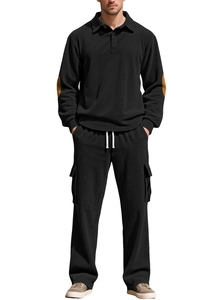 Detailed view of the black corduroy texture on men's long sleeve polo and cargo pants set