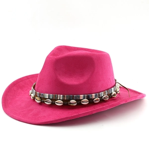 Detail of rose pink suede cowboy hat featuring bohemian shell band and colorful ribbon