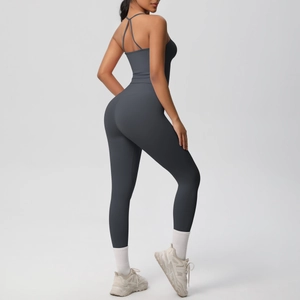 Detail of cross-strap back design on seamless dark grey yoga jumpsuit for workout