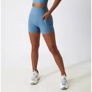Detail shot of high-waisted yoga shorts in light blue with functional side pocket